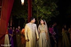 Lovely indian couple holding hands indian bride fashion,bridal lehenga