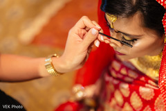 Indian bride getting her makeup done Indian bride getting her makeup done