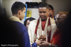 Indian groom during pre wedding ceremony moments Indian groom during pre wedding ceremony moments