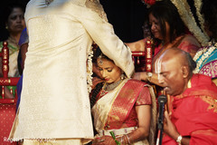 Indian bride receiving her necklace Indian bride receiving her necklace