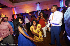 Indian couple dancing with guests Indian couple dancing with guests