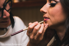 Indian bride getting her makeup done Indian bride getting her makeup done