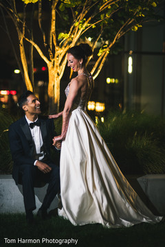 Indian bride and groom enjoying each other's company Indian bride and groom enjoying each other's company