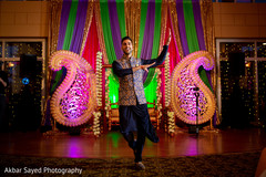 Indian groom dancing during sangeet Indian groom dancing during sangeet