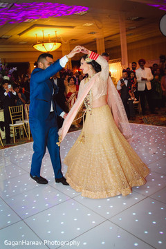 Adorable indian couple dancing during reception Adorable indian couple dancing during reception