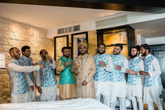 Indian groom with groomsmen toasting Indian groom with groomsmen toasting