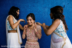 Beautiful indian bridesmaids helping bride Beautiful indian bridesmaids helping bride