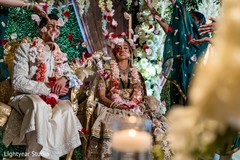 Indian couple showered with rose petals Indian couple showered with rose petals