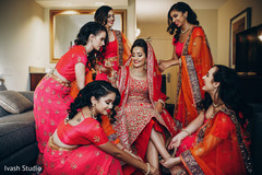 Indian bridesmaids helping the bride Indian bridesmaids helping the bride