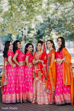 Indian bride posing with bridesmaids Indian bride posing with bridesmaids