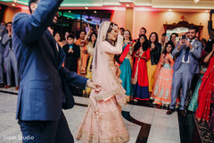 Indian bride and groom performing a choreography Indian bride and groom performing a choreography