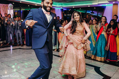 Indian couple joyfully dancing Indian couple joyfully dancing