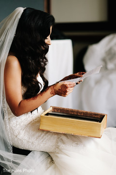 Indian bride reading a letter ready for her wedding Indian bride reading a letter ready for her wedding