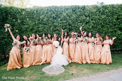 Joyful indian bride with bridesmaids capture