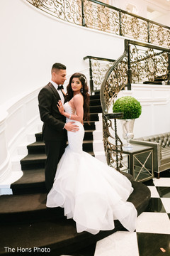 Elegant indian groom with parents portrait