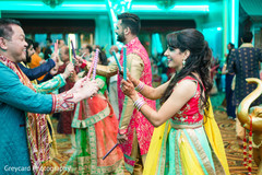Adorable indian bride during dandia raas ritual