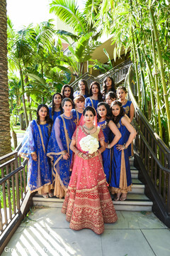 Glamorous indian bride posing with bridesmaids Glamorous indian bride posing with bridesmaids