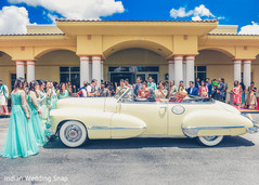 Lovely capture of indian bride and groom on their wedding car Lovely capture of indian bride and groom on their wedding car