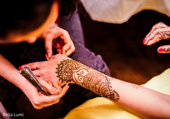 Mehndi artist at work Mehndi artist at work