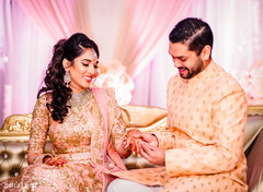 Indian bride receiving her engagement ring Indian bride receiving her engagement ring