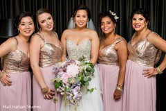 Lovely indian bride posing with bridesmaids Lovely indian bride posing with bridesmaids