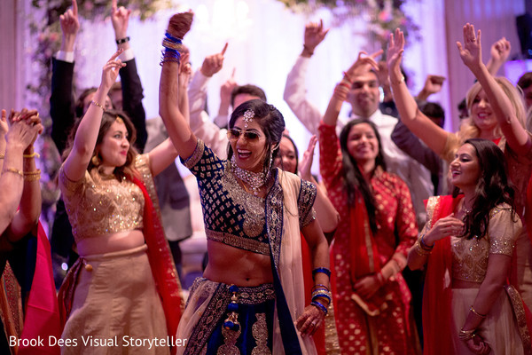 Cheerful indian wedding guests capture