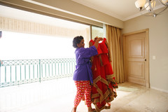 Indian bride getting her wedding attire ready. Indian bride getting her wedding attire ready.