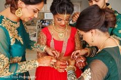 Joyful Indian bride getting ready for wedding ceremony. Joyful Indian bride getting ready for wedding ceremony.