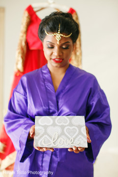 Lovely Indian bride holding card capture. Lovely Indian bride holding card capture.