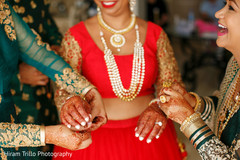 Joyful capture getting jewelry on bride. Joyful capture getting jewelry on bride.