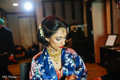 Adorable indian bride getting ready