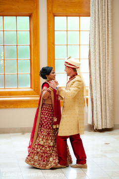 Indian bride and groom first look scene. Indian bride and groom first look scene.