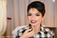 Beautiful indian bride being dolled up for her ceremony Beautiful indian bride being dolled up for her ceremony