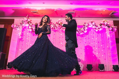 Newly weds making a play at wedding reception. Newly weds making a play at wedding reception.