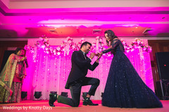 Indian groom putting bride the wedding ring at a performance. Indian groom putting bride the wedding ring at a performance.