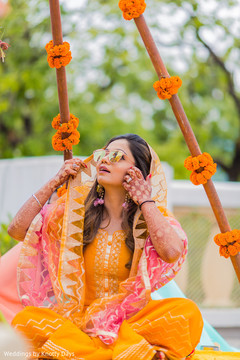 Marvelous look of Indian bride on her mehndi party outfit. Marvelous look of Indian bride on her mehndi party outfit.