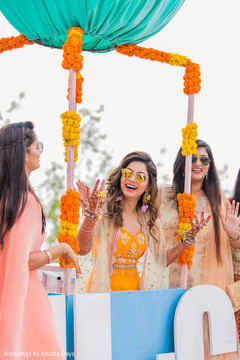 Indian bride getting ready with bridesmaids for photo session. Indian bride getting ready with bridesmaids for photo session.