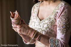 Indian bride putting bangles on Indian bride putting bangles on