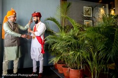 Charming indian groom getting ready scene Charming indian groom getting ready scene