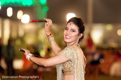 Adorable indian bride during dandia raas ritual Adorable indian bride during dandia raas ritual