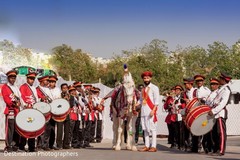 Indian groom posing with baraat horse Indian groom posing with baraat horse