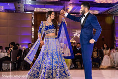 Charming Indian bride and groom enjoying wedding dance. Charming Indian bride and groom enjoying wedding dance.
