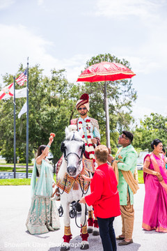 Elegant Indian groom riding baraat white horse. Elegant Indian groom riding baraat white horse.