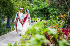 Adorable Indian couple walking holding hands. Adorable Indian couple walking holding hands.