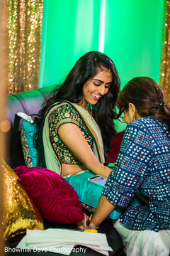 Indian pre-wedding celebration to have henna art done. Indian pre-wedding celebration to have henna art done.