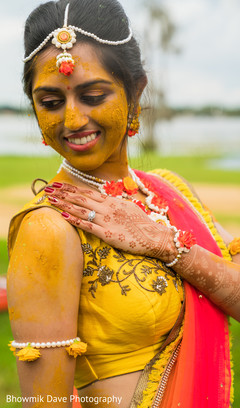 Maharani posing with turmeric paste on. Maharani posing with turmeric paste on.