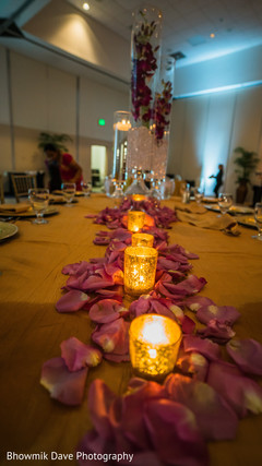 Indian wedding table rose petals decoration capture. Indian wedding table rose petals decoration capture.