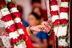 Indian groom taking hand of bride on wedding ceremony Indian groom taking hand of bride on wedding ceremony