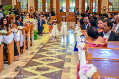 Lovely flower girls walking in to announce the bride is coming. Lovely flower girls walking in to announce the bride is coming.