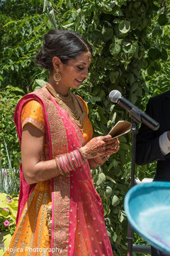 Indian bride reading her bows capture. Indian bride reading her bows capture.